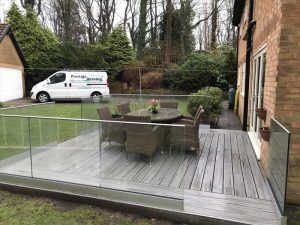 Square Trex Island Mist deck with clear glass railings