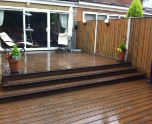 Large brown Trex deck with steps