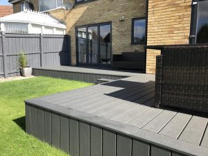 Raised grey Trex deck attached to house