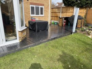 Small grey Trex deck outside house