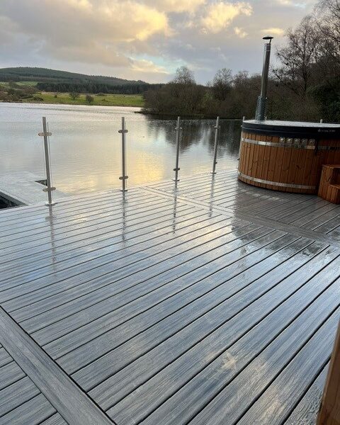 Jetty decking over lake with hot tub