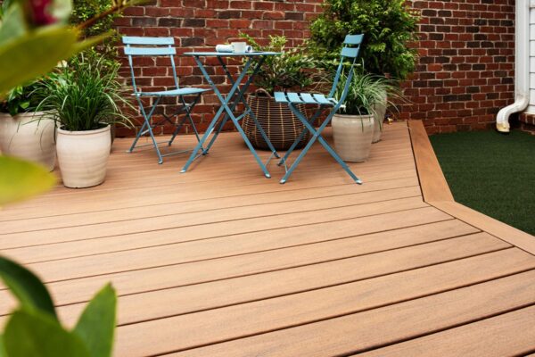 Jasper Trex Transcend Lineage composite decking, brown garden decking with table and chairs