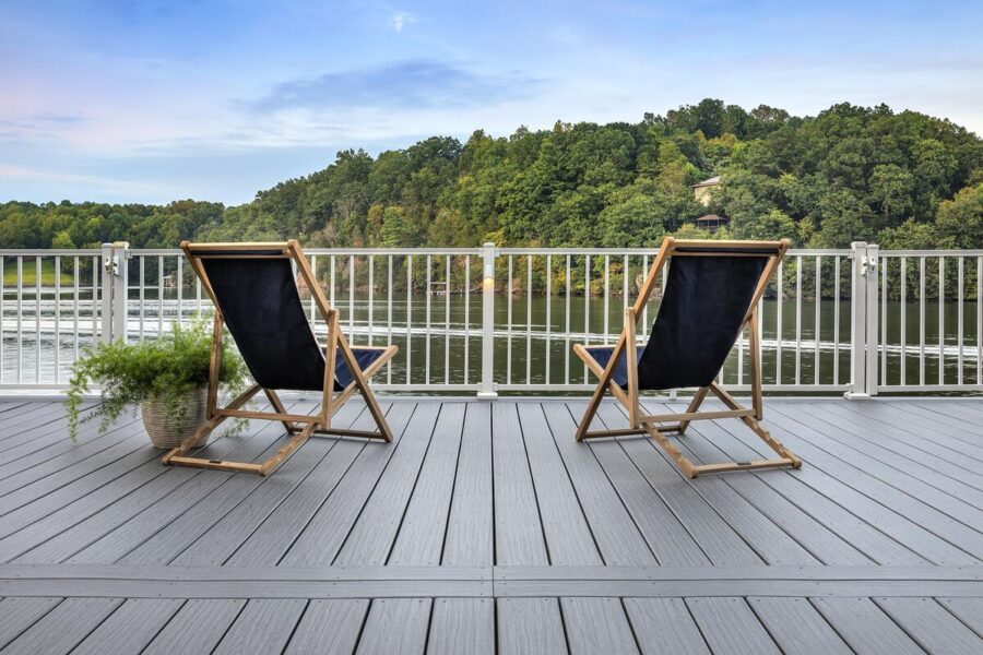 Trex signature composite decking around a lake with white railing