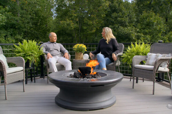 Trex Signature decking in Whidbey, couple sat around fire pit on composite decking relaxing