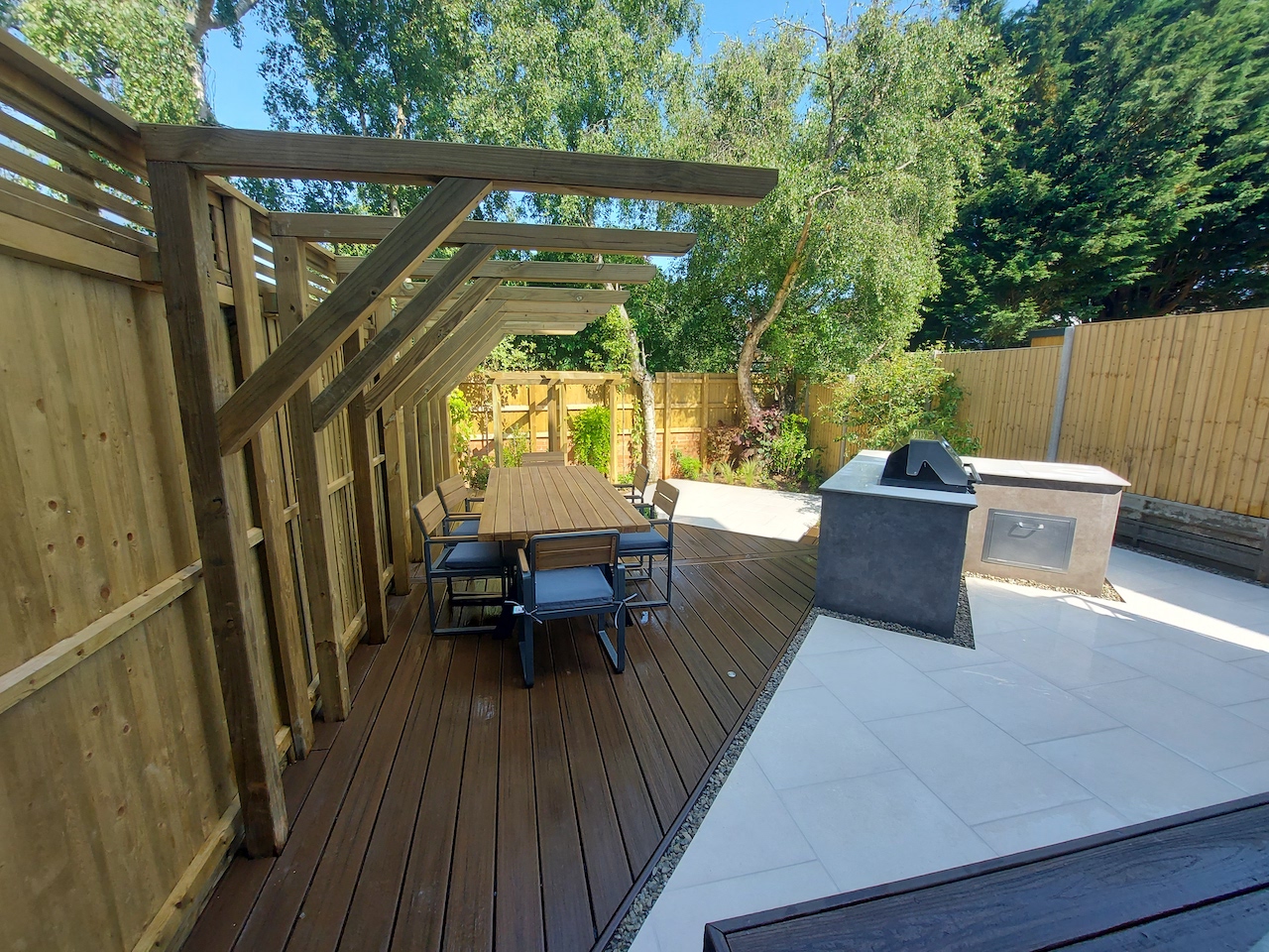 Triangular composite deck with bespoke pergola and outdoor kitchen